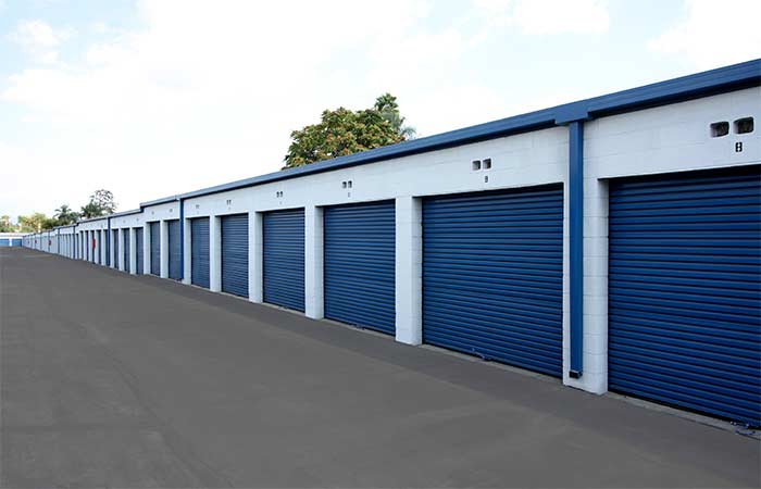 Drive-up storage units in a wide aisle for easy access.