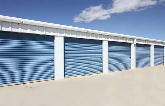 Large drive-up storage units with easy access roll-up doors.