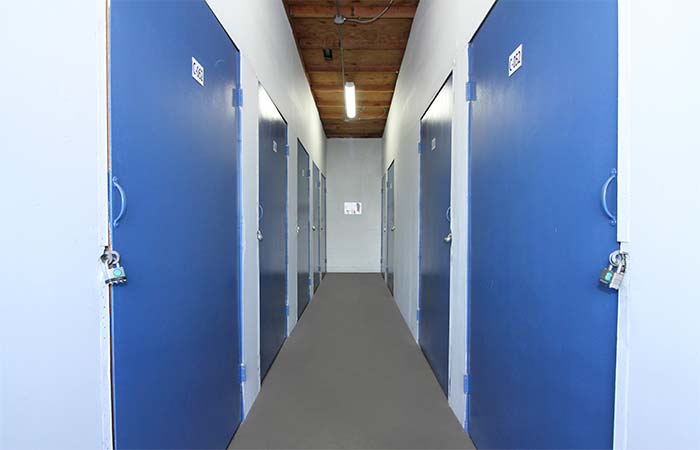 Indoor storage units with swing doors.
