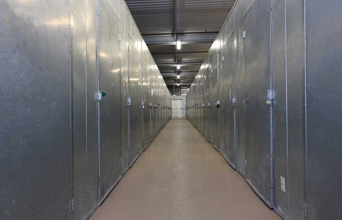 Indoor storage units with swing doors.