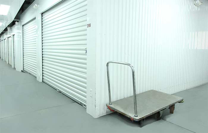 Indoor push cart available for easy unloading and loading of storage items.