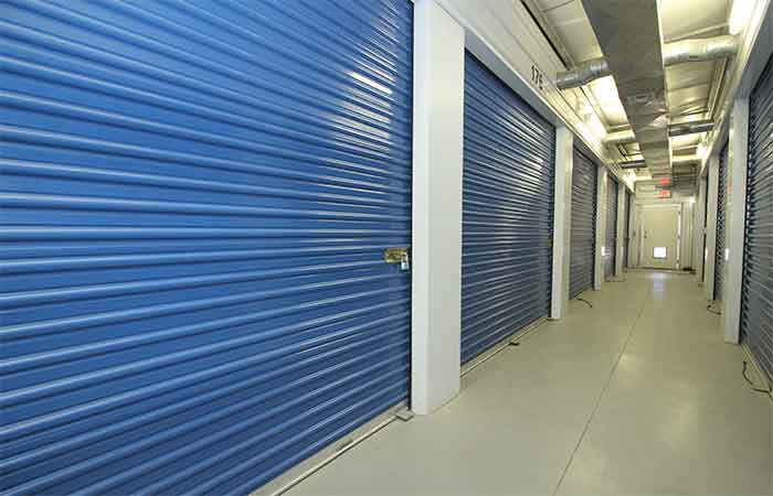 Large indoor climate controlled storage units with roll-up doors.