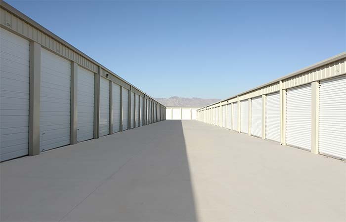 Drive-up storage units located in a wide aisle for easy access.