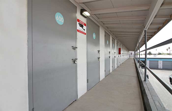 Storage units located on the second floor with swing doors.