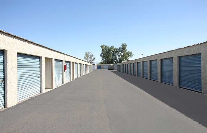 Large drive-up storage units in a wide aisle for easy access.