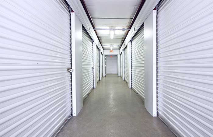 Large indoor storage units with roll-up doors.