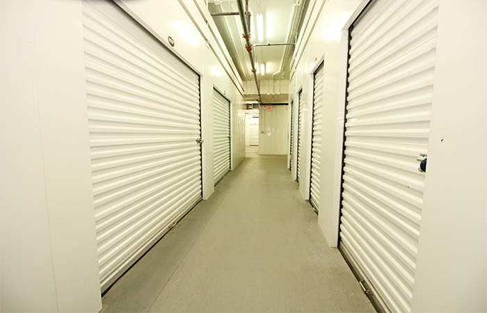 Large indoor storage unit with roll-up door.