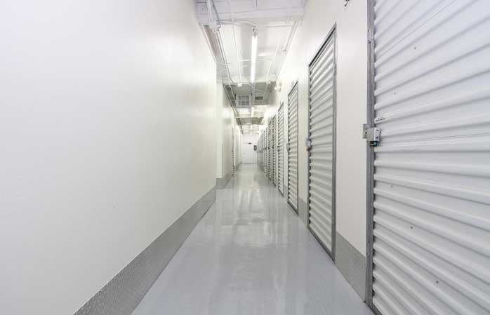 Climate controlled storage units in a well-lit hallway.