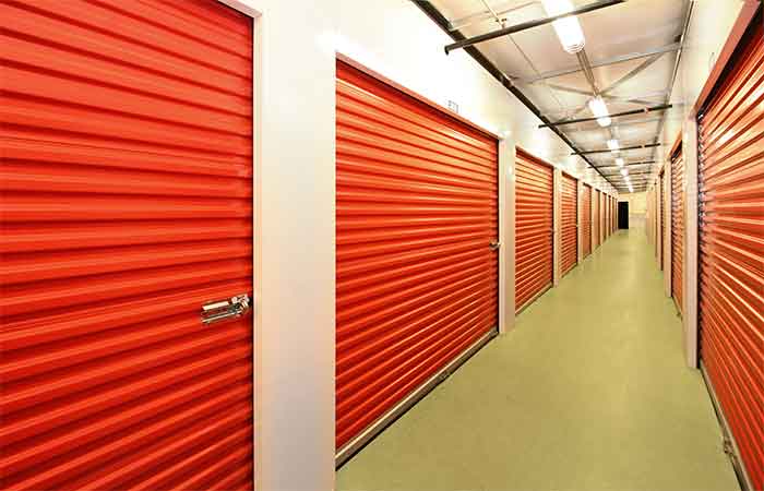 Indoor storage units with roll-up doors for ease of access.