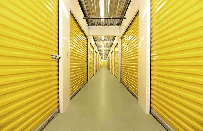 Large indoor storage units with roll-up doors.