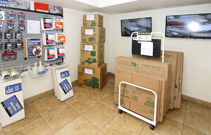 Moving and packing supplies for sale, including boxes, tape, locks, and more.