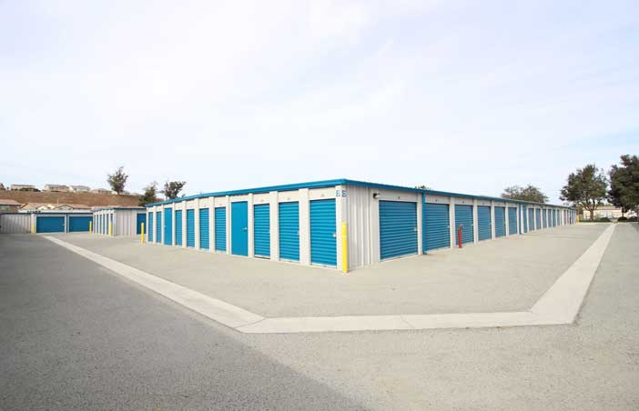 Small drive-up-storage units with roll-up doors and easy access.