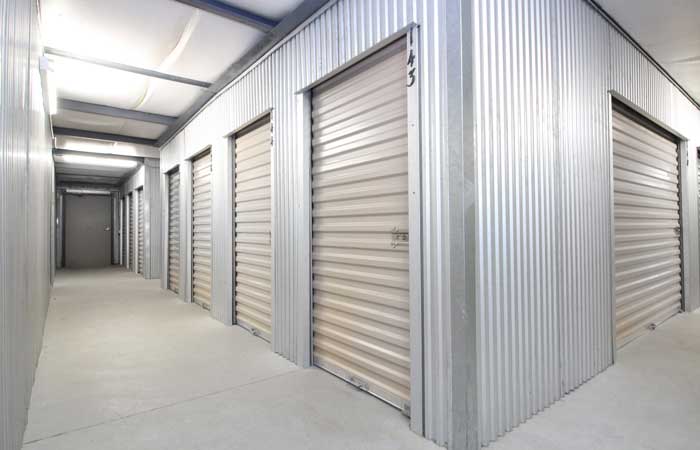 Small indoor storage units with roll-up doors and easy access.