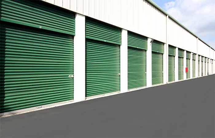 Large drive-up storage unit with roll-up door for ease of access.