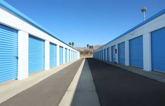 Drive-up storage units with wide aisles for easy access.