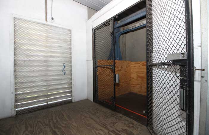 Indoor service elevator for ease of loading and unloading units.