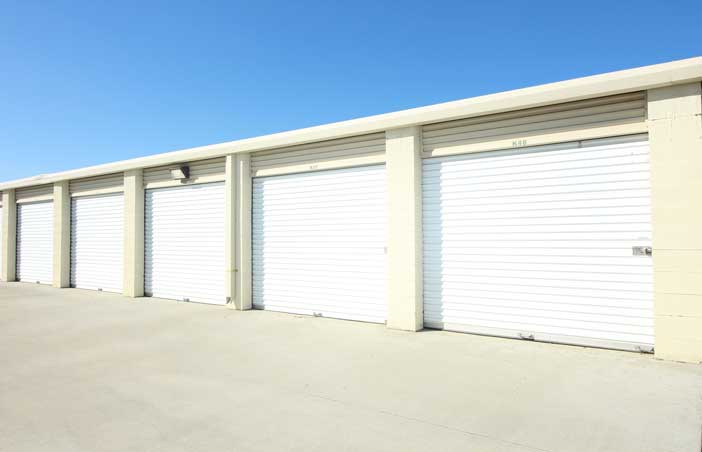 Large drive-up storage unit aisle.