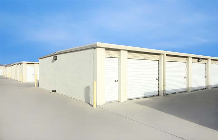 Small and large drive-up storage units with roll-up doors.