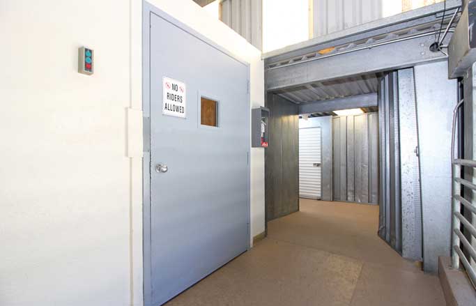 Indoor service elevator for ease of loading and unloading units.