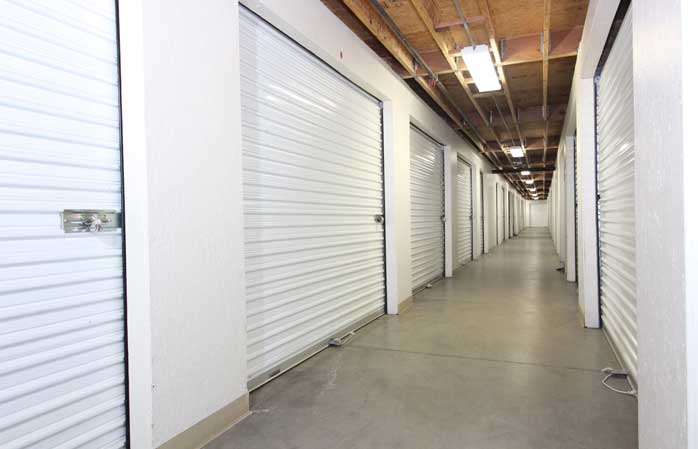 Indoor storage units with roll-up doors.