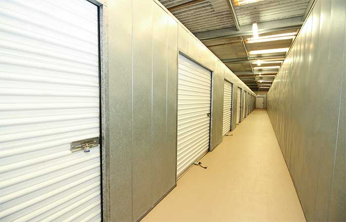 Indoor storage units with roll-up doors.