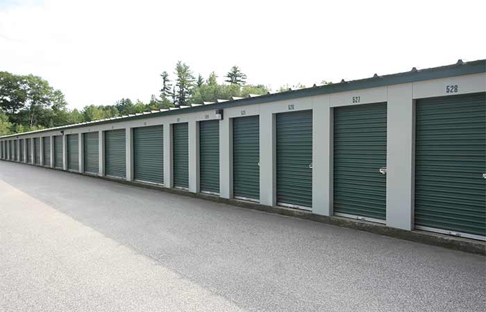 Drive-up storage units with roll-up doors and easy access.