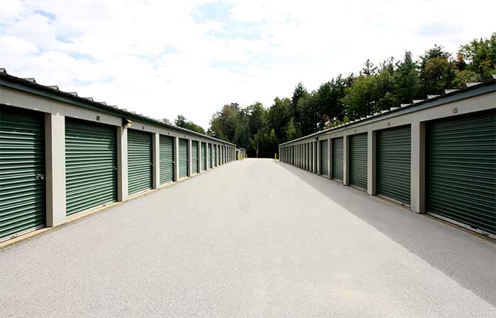 Drive-up storage units in a wide aisle for easy access.