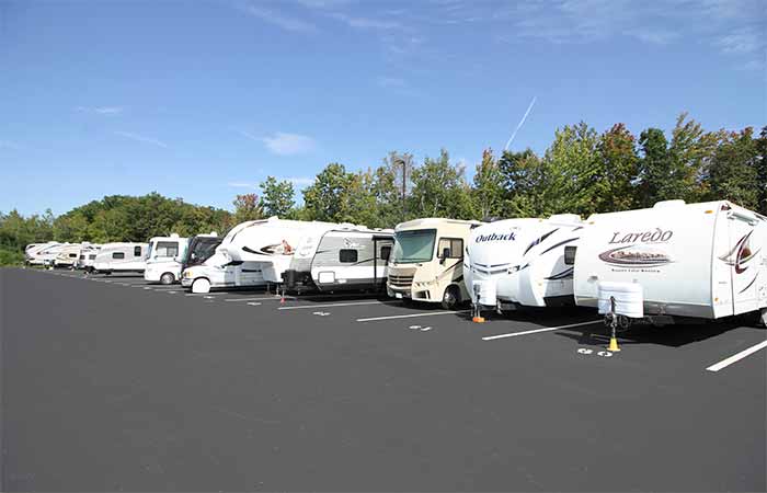 Paved parking spaces available for RV's, trailers, boats, and more.