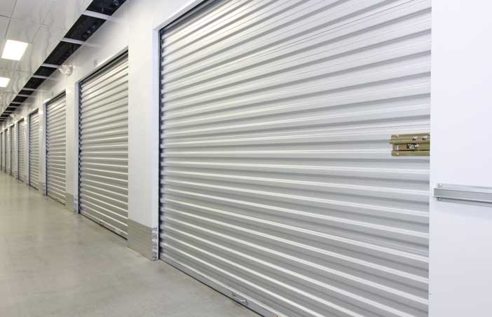 Large climate controlled storage unit with a roll-up door.