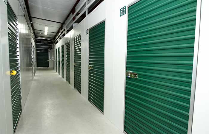 Indoor climate controlled storage units with swing doors.