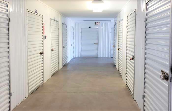 Indoor storage units with easy access in a well-lit hallway.