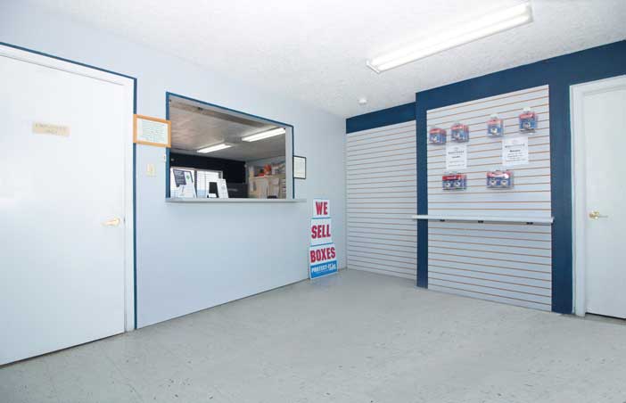 Storage office lobby with supplies for sale.