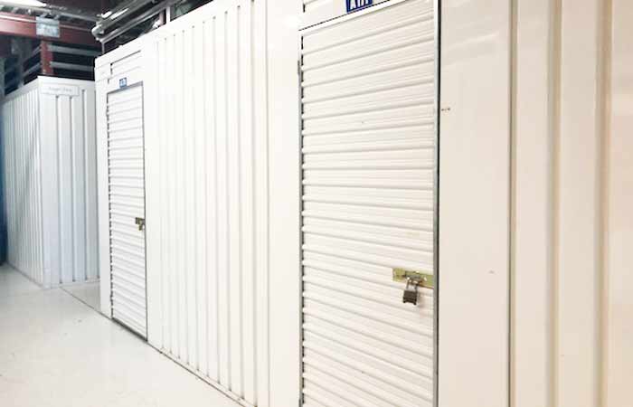 Indoor climate controlled storage units with swing doors.