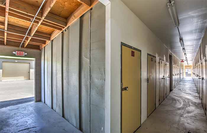 Breezeway storage units with swing doors.