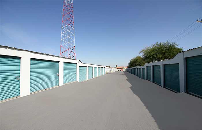 Wide aisle drive-up storage units with easy access and roll-up doors.