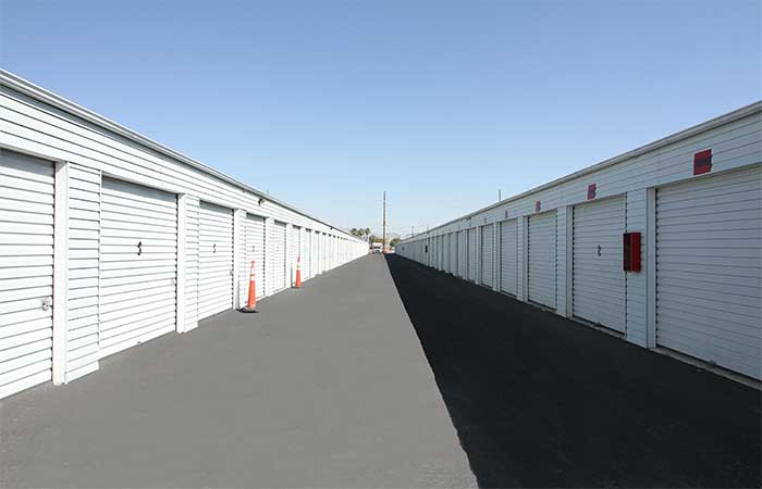 Drive-up storage units with wide aisles for easy access.