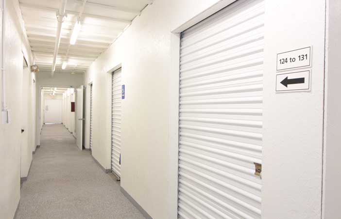 ADA indoor storage units in a well-lit hallway.