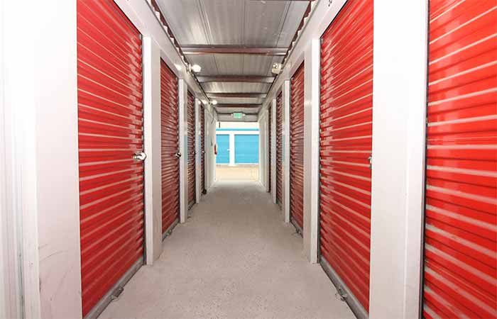 Breezeway storage units with roll-up doors.