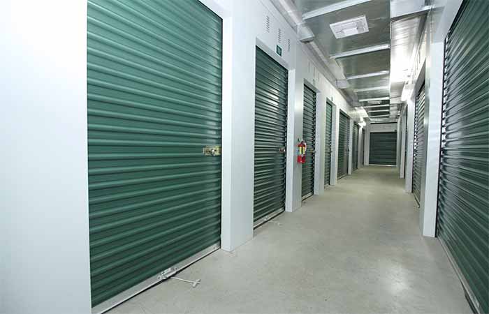 Indoor climate controlled storage units with roll-up doors for easy access.