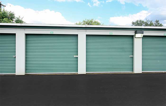 Large drive-up storage units with easy access and roll-up doors.