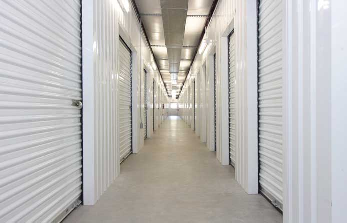 Small indoor climate controlled units with roll-up doors.