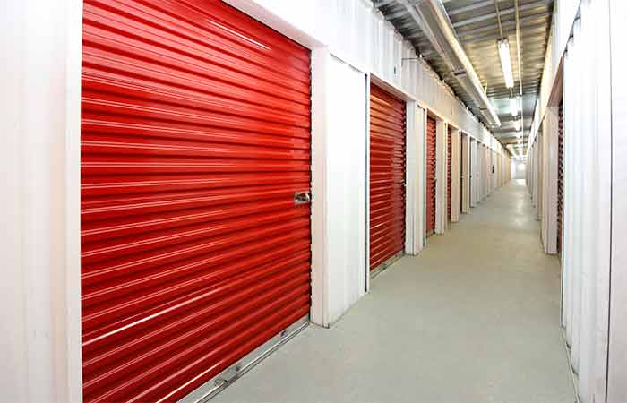 Indoor climate controlled units with roll-up doors for easy access.