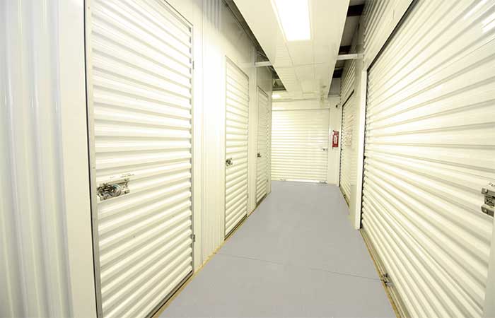Indoor climate controlled units in well-lit hallways.