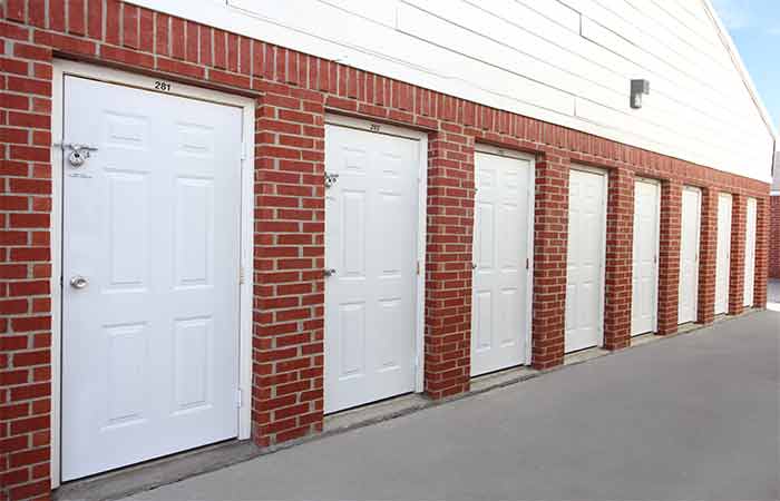 Small storage units in a breezeway with easy access.