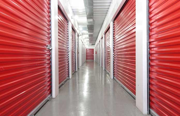 Climate controlled storage units in a well-lit hallway.