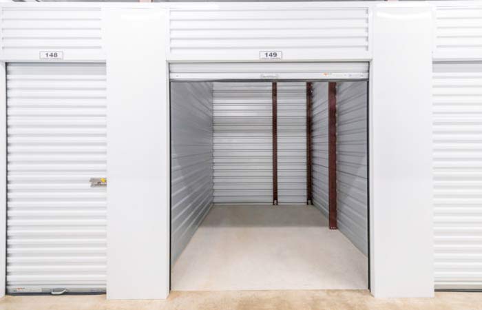 Indoor climate controlled storage unit with roll-up door.