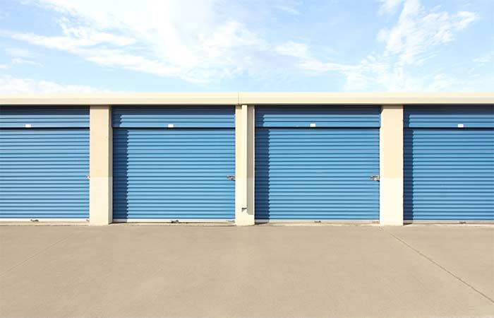 Drive-up storage units with easy access and roll-up doors.