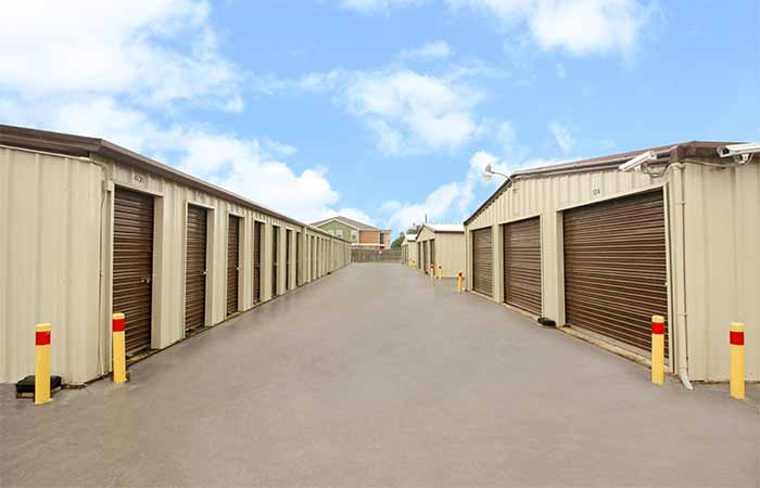 Drive-up storage units located in a wide aisle for easy access.
