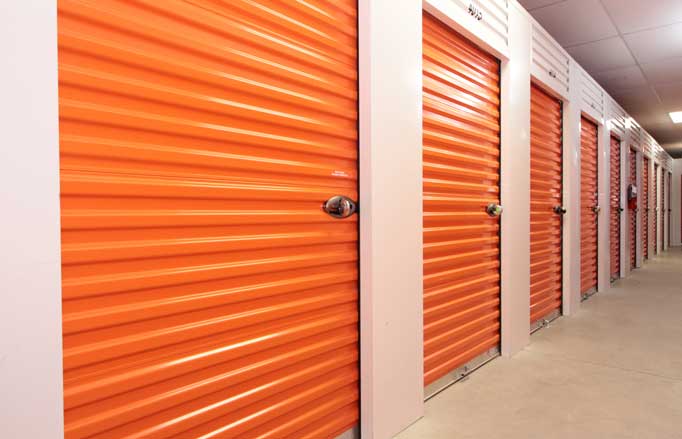 Small climate controlled storage units with roll-up doors.
