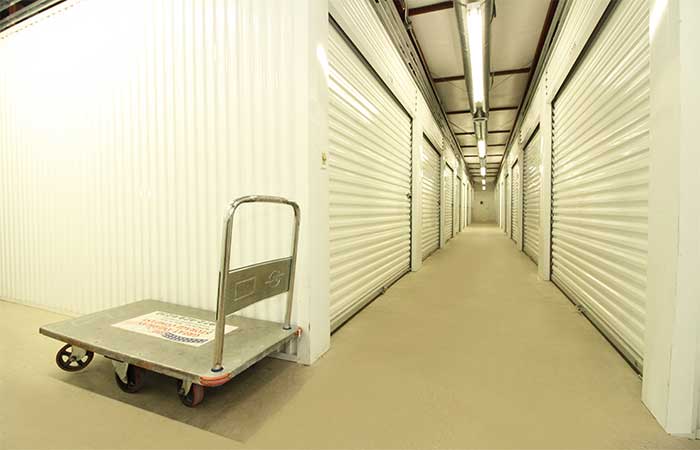 Indoor dolly cart for easy loading and un-loading of storage items.